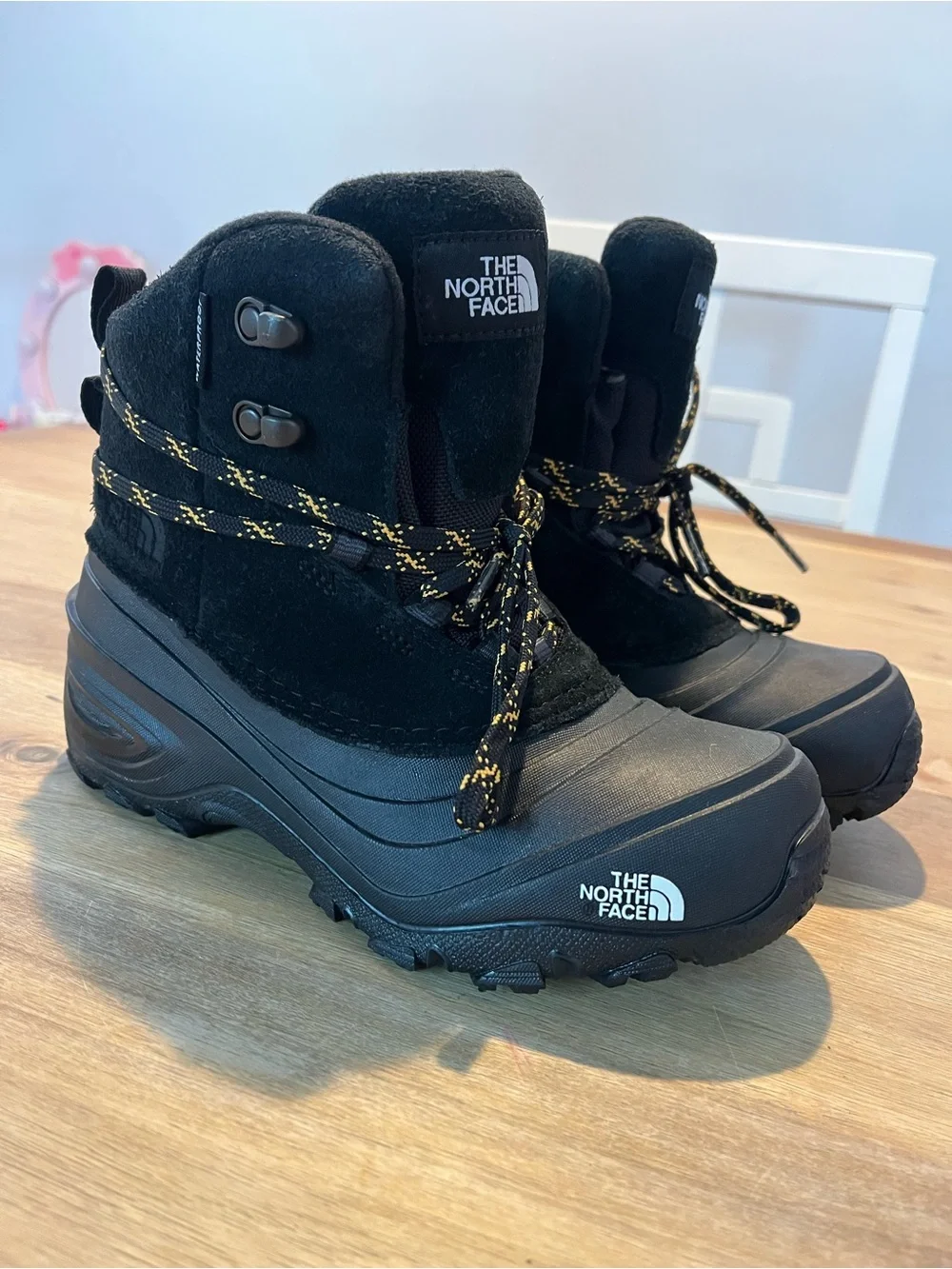 The North Face Black Boots with Yellow-Accent Laces
